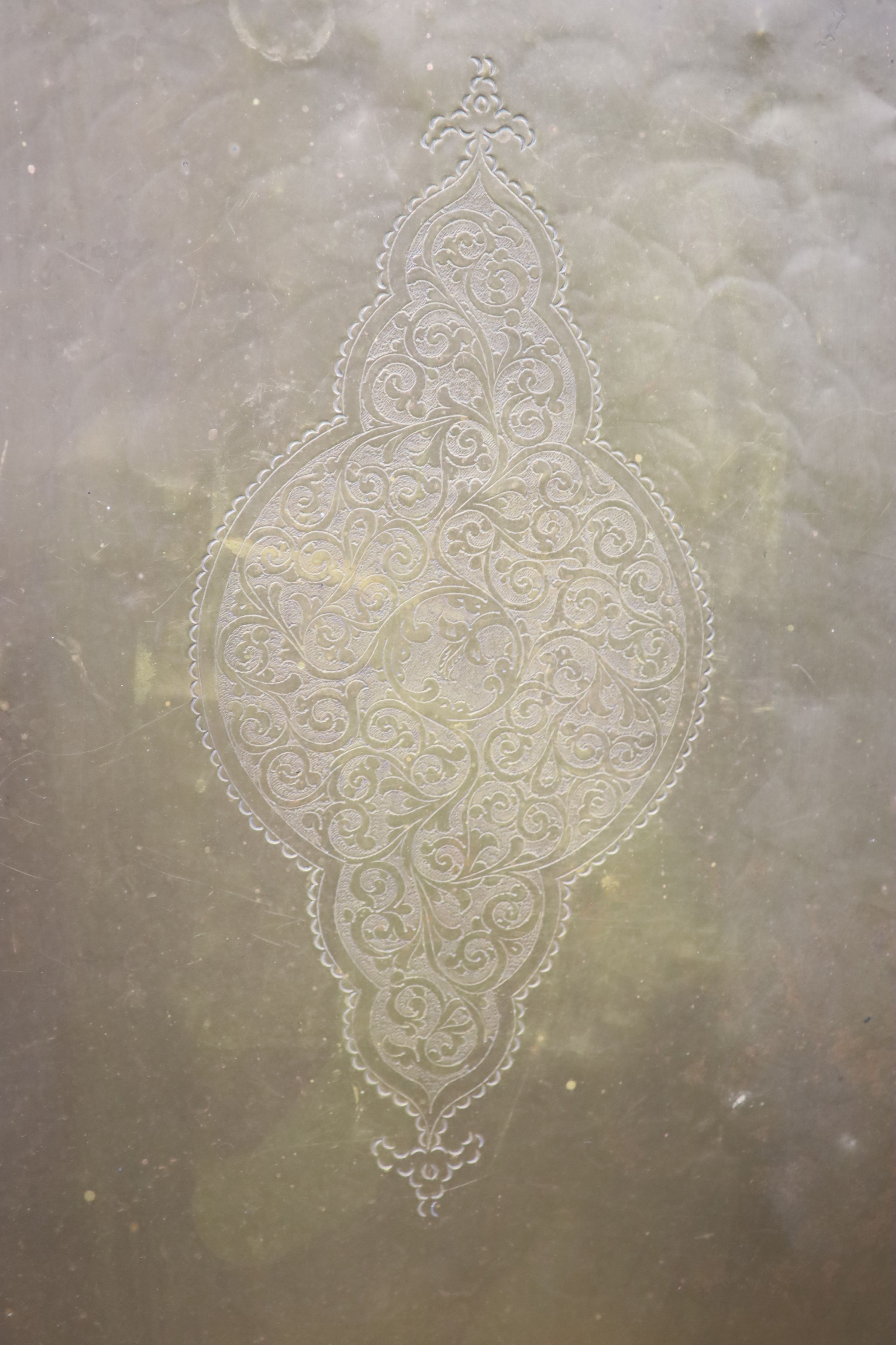 A rectangular Persian engraved brass tray, width 62cm, height 96cm